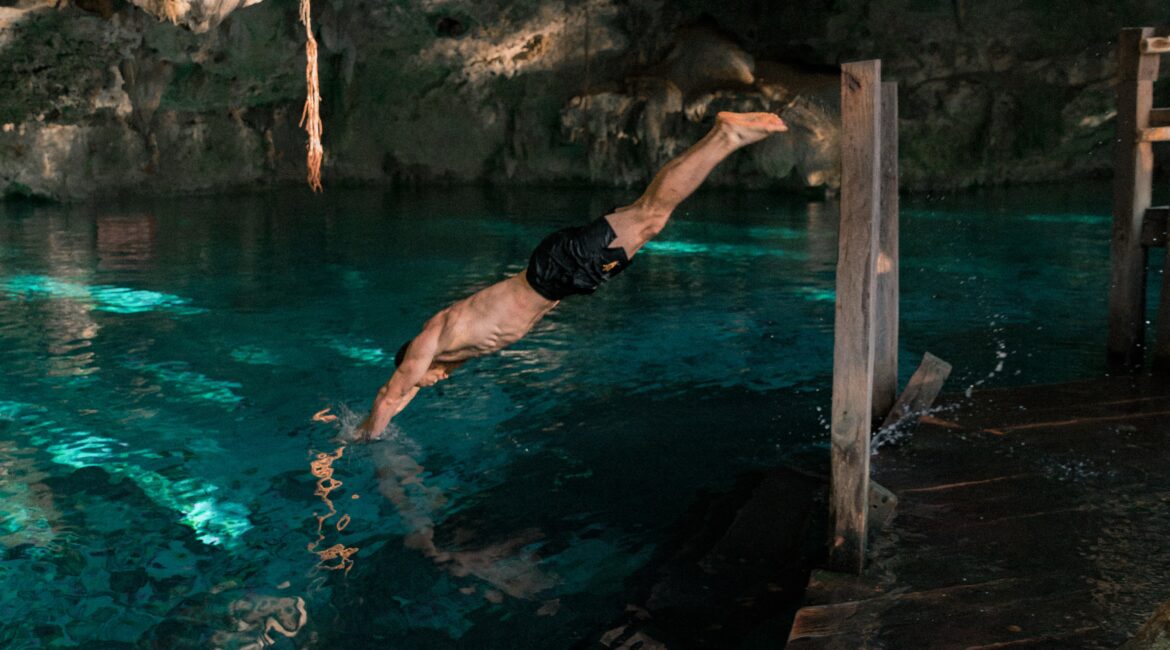 man diving cenote